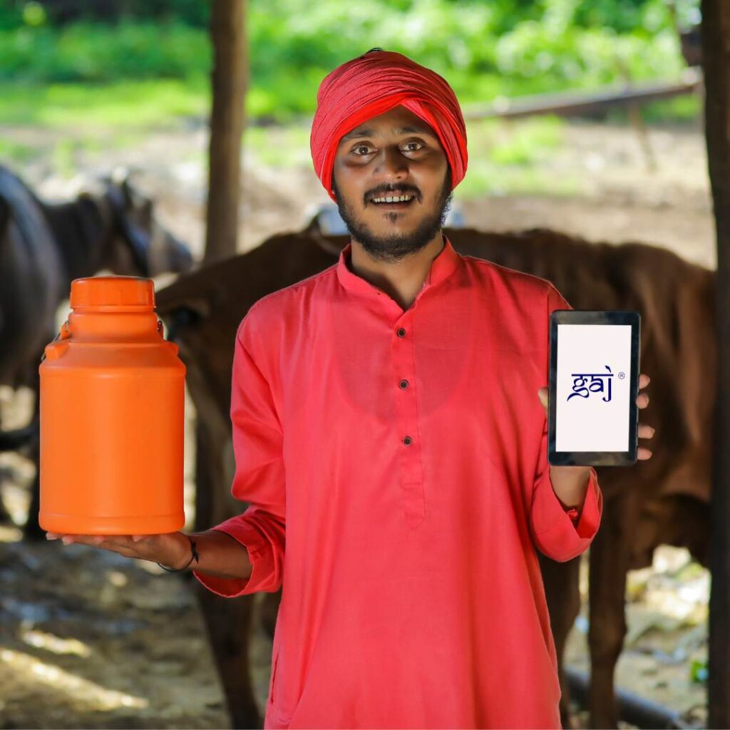 Farmer holding Gaj Milk