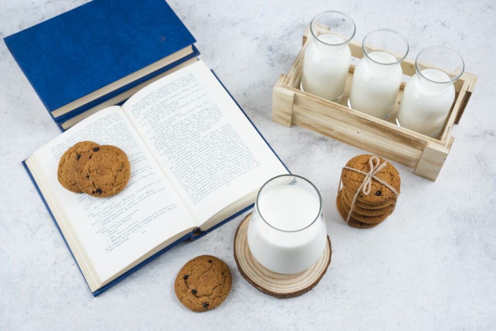Delicious-cookies-with-glass-of-milk-and-book